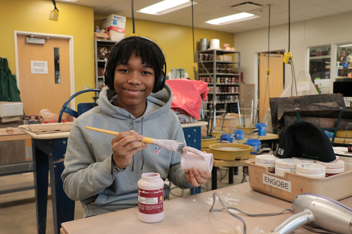 A student works on artwork